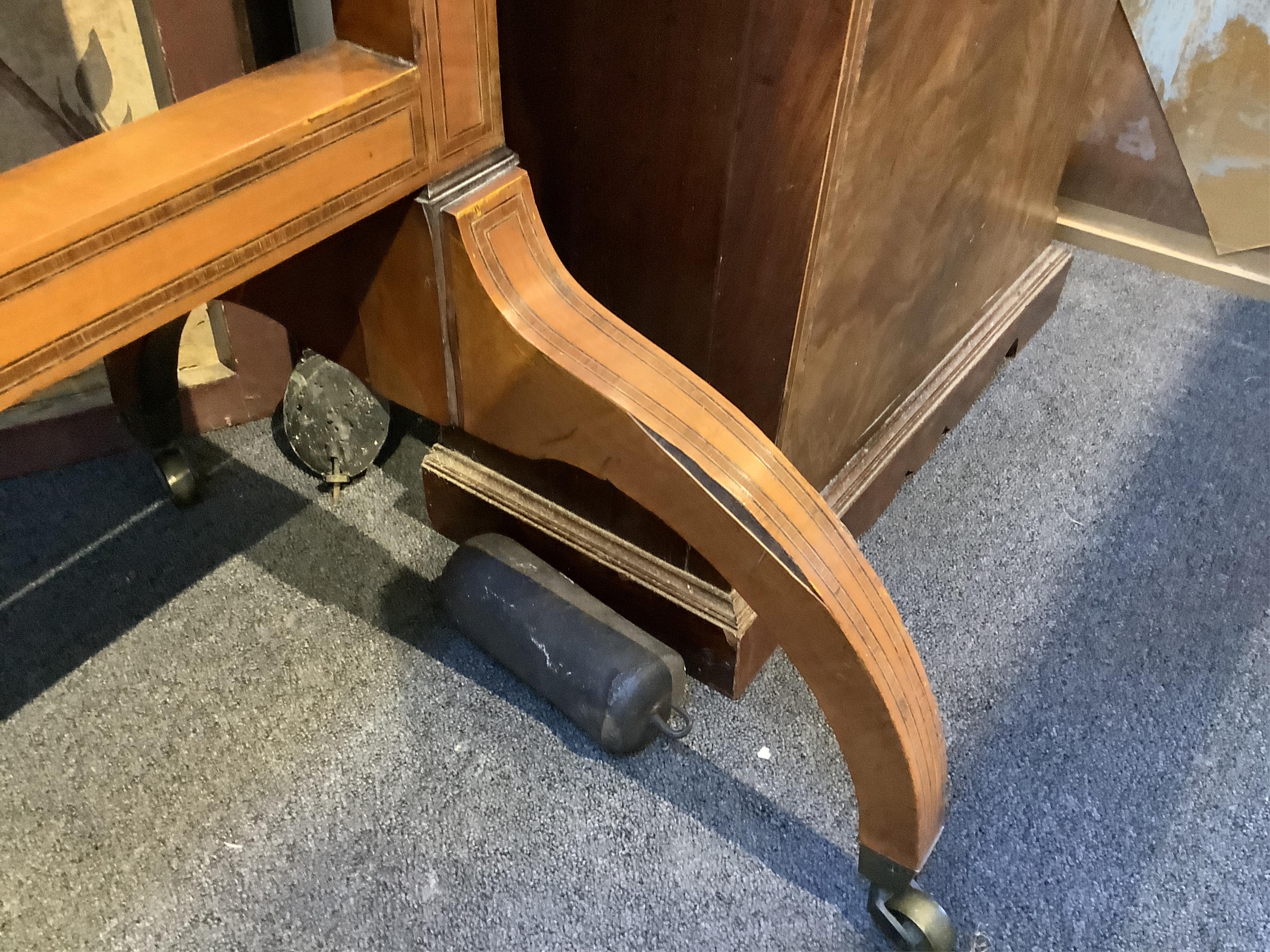 An Edwardian satinwood cheval mirror